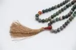 Bloodstone & Carnelian Mala – handcrafted 108-bead prayer necklace made from natural bloodstone and carnelian gemstones, known for boosting energy, courage, and grounding. Ideal for meditation, chakra healing, and spiritual strength.