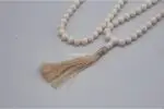 Conch Shell Prayer Beads (Mala) – handcrafted 108-bead mala made from natural conch shell, symbolizing purity and sacred sound in Tibetan Buddhism. Ideal for mantra chanting, meditation, and spiritual rituals.