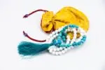 Conch Shell & Turquoise Prayer Beads – handcrafted 108-bead mala made from natural conch shell and turquoise stones, symbolizing purity, protection, and spiritual balance. Ideal for mantra chanting, meditation, and healing rituals.