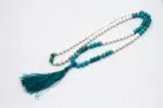 Conch Shell & Turquoise Prayer Beads – handcrafted 108-bead mala made from natural conch shell and turquoise stones, symbolizing purity, protection, and spiritual balance. Ideal for mantra chanting, meditation, and healing rituals.