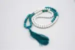 Conch Shell & Turquoise Prayer Beads – handcrafted 108-bead mala made from natural conch shell and turquoise stones, symbolizing purity, protection, and spiritual balance. Ideal for mantra chanting, meditation, and healing rituals.
