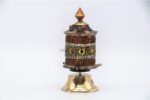Tibetan mantra prayer wheel with embossed Om Mani Padme Hum