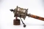 Handheld Tibetan Prayer Wheel with wooden handle and engraved mantra