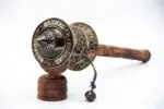 Handheld Tibetan Prayer Wheel with wooden handle and engraved mantra