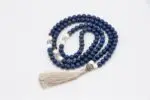 Lapis, Conch Shell & Crystal Mala – handcrafted 108-bead prayer necklace combining lapis lazuli for wisdom, conch shell for purity, and crystal quartz for clarity and spiritual energy. Ideal for meditation, mantra chanting, and chakra alignment.