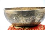 Large handmade singing bowl with Buddha engraving, Tibetan mantras, and mandala base