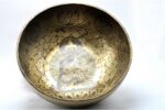 Large handmade singing bowl with Buddha engraving, Tibetan mantras, and mandala base