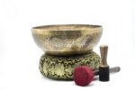 Large handmade singing bowl with Buddha foot carving, chakra symbols, Ashtamangala, and Shree Yantra