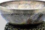 Large handmade singing bowl with Buddha foot carving, chakra symbols, Ashtamangala, and Shree Yantra