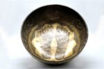Large handmade singing bowl with Buddha foot carving, chakra symbols, Ashtamangala, and Shree Yantra