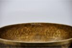 Large handmade singing bowl with Yin Yang Tree of Life design, mantra etching, and chakra healing use