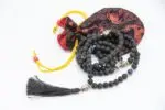 Lava Stone Mala with Buddha Head – handcrafted 108-bead prayer necklace made from natural lava stones with a Buddha head bead centerpiece, symbolizing grounding, strength, and spiritual awareness. Ideal for meditation and daily mindfulness.