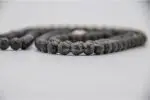Lava Stone Mala with Buddha Head – handcrafted 108-bead prayer necklace made from natural lava stones with a Buddha head bead centerpiece, symbolizing grounding, strength, and spiritual awareness. Ideal for meditation and daily mindfulness.