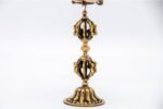 lose-up of engraved Om Mani Padme Hum mantra on Tibetan prayer wheel Bottom view of Vajra brass base on Buddhist prayer wheel Prayer wheel being held and spun – traditional dharma practice