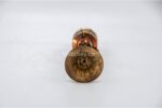lose-up of engraved Om Mani Padme Hum mantra on Tibetan prayer wheel Bottom view of Vajra brass base on Buddhist prayer wheel Prayer wheel being held and spun – traditional dharma practice