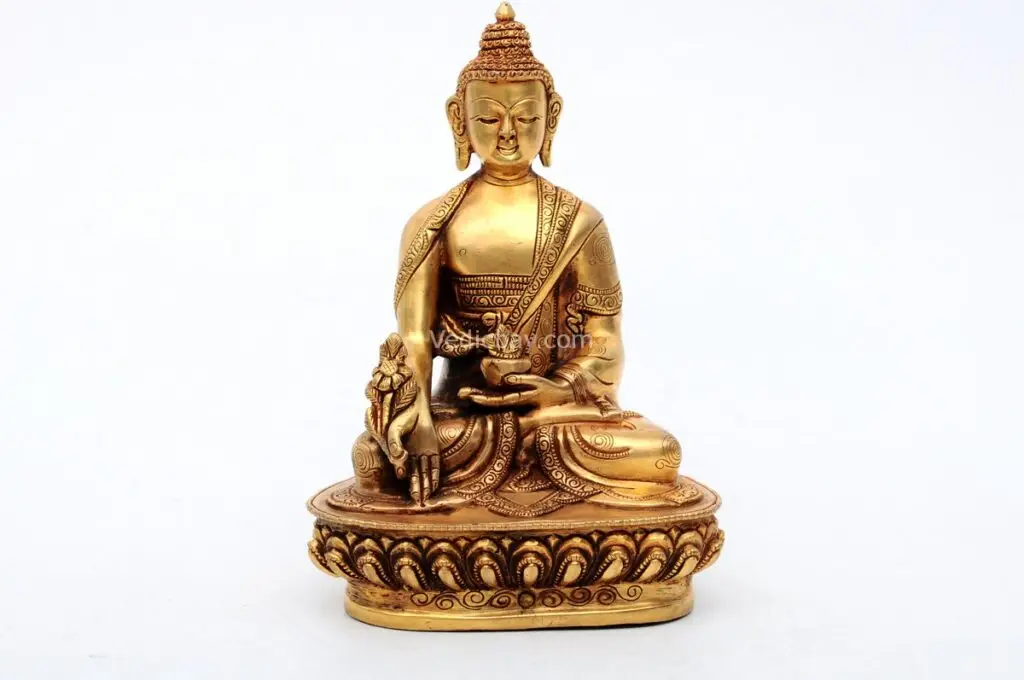 Handcrafted Medicine Buddha Statue holding a healing bowl – made from brass with detailed carvings, symbolizing health, healing, and compassion, ideal for meditation and wellness spaces.