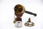 Close-up of Om Mani Padme Hum engraved copper wheel