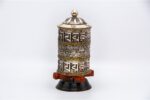 White metal prayer wheel with embossed eight auspicious symbols from Nepal