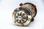 White metal prayer wheel with embossed eight auspicious symbols from Nepal