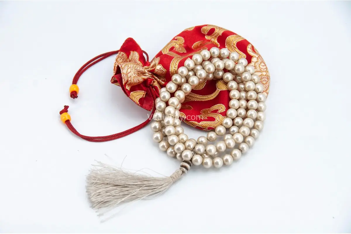 Pearl Mala – handcrafted 108-bead prayer necklace made from natural pearls, symbolizing purity, wisdom, and inner peace. Ideal for meditation, mantra chanting, spiritual rituals, and calming the mind.