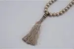 Pearl Mala – handcrafted 108-bead prayer necklace made from natural pearls, symbolizing purity, wisdom, and inner peace. Ideal for meditation, mantra chanting, spiritual rituals, and calming the mind.