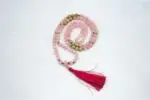 Rose Quartz Mala – handcrafted 108-bead prayer necklace made from natural rose quartz gemstones, symbolizing love, compassion, and emotional healing. Ideal for meditation, heart chakra work, and spiritual rituals.