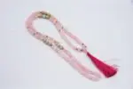 Rose Quartz Mala – handcrafted 108-bead prayer necklace made from natural rose quartz gemstones, symbolizing love, compassion, and emotional healing. Ideal for meditation, heart chakra work, and spiritual rituals.