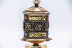 Tabletop copper prayer wheel with brass detailing
