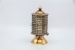 Tibetan Prayer Wheel placed on altar for meditation and spiritual blessings