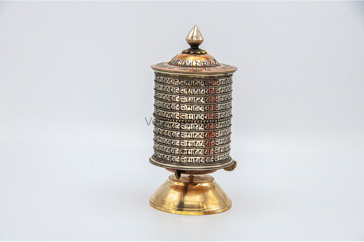 tibetan-tabletop-dharma-wheel Tibetan Prayer Wheel placed on altar for meditation and spiritual blessings