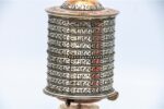 Tibetan Prayer Wheel placed on altar for meditation and spiritual blessings