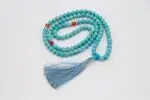 Turquoise Stone Mala – handcrafted 108-bead prayer necklace made from natural turquoise gemstones, symbolizing protection, healing, and spiritual balance. Ideal for meditation, mantra chanting, and energy alignment.
