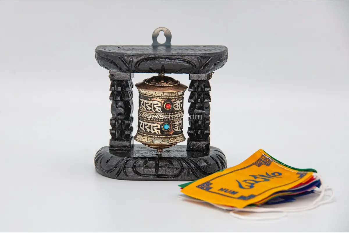 Tibetan prayer wheel with carved wooden frame – handmade in Nepal
