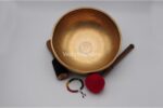 10.5 inch handmade Jhumka singing bowl with dim finish – crafted in Nepal, includes mallet, felt drum stick, cushion, and chakra bracelet