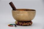 8 inch handmade Jhumka singing bowl with dim finish – crafted in Nepal, includes mallet, cushion, and chakra bracelet
