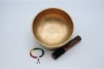 8 inch handmade Jhumka singing bowl with dim finish – crafted in Nepal, includes mallet, cushion, and chakra bracelet