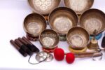 Professionally tuned 7 chakra Tibetan singing bowl set with mantra etching, handmade in Nepal with bell, tingsa, and accessories