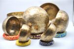 Top view of 7-piece Tibetan Full Moon Singing Bowl Set arranged by chakra size – handcrafted in Nepal