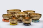Top view of 7-piece Tibetan Full Moon Singing Bowl Set arranged by chakra size – handcrafted in Nepal