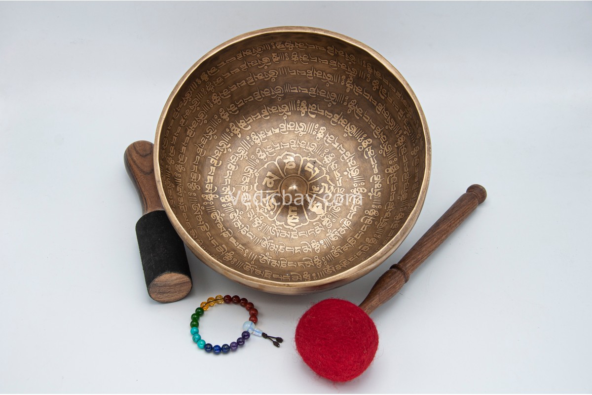 10-inch Lingam Tibetan singing bowl decorated with mantra and lucky symbols – includes cushion, wooden mallet, felt striker, and bracelet – VedicBay