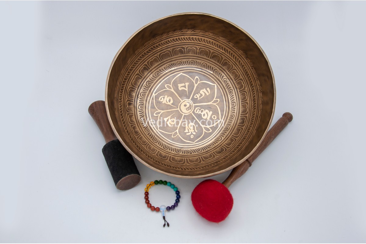 11-inch Tibetan singing bowl with mantra around, mandala in center, and conch on back – includes cushion, wooden mallet, felt striker, and bracelet – VedicBay